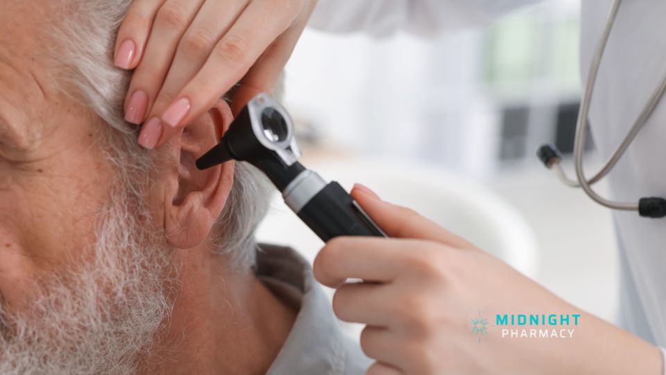 Older man getting an ear check