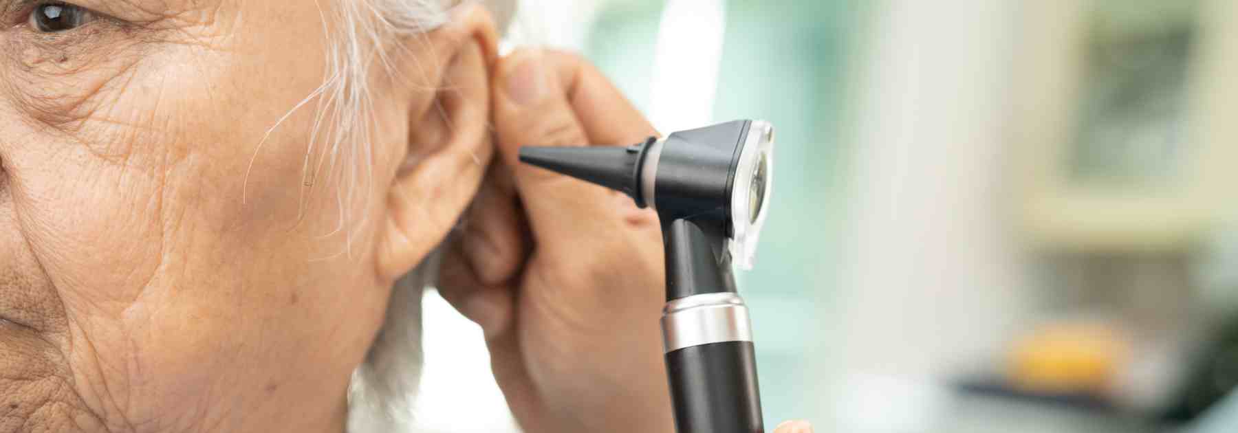 Elderly patient getting his ears checked in Bradford