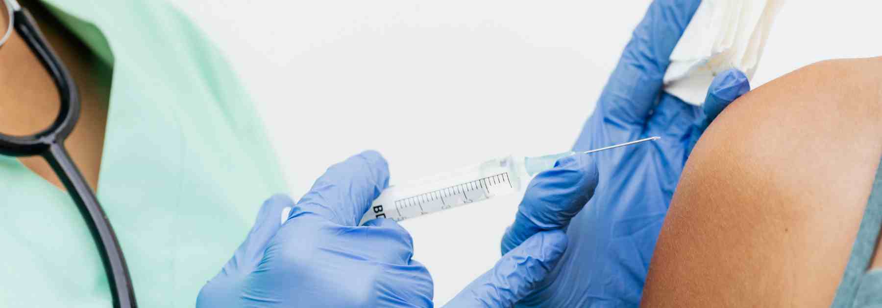 Travel vaccine being administered in upper arm