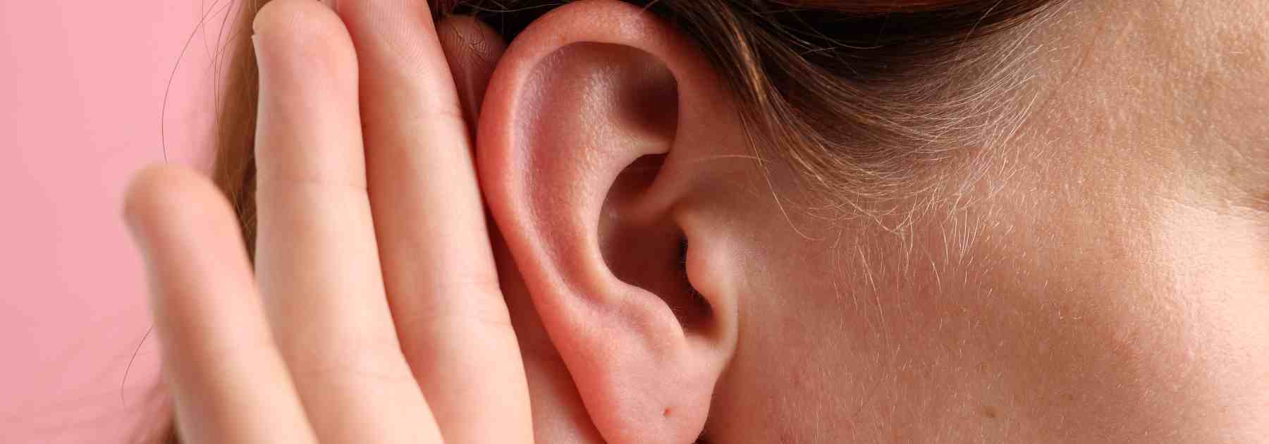 Close up of an ear, cupped because of wax build up