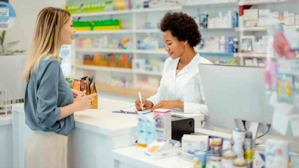 Woman getting heathcare support in a pharmacy