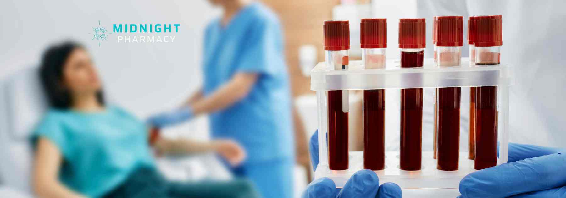Blood test being done with test tubes in the foreground