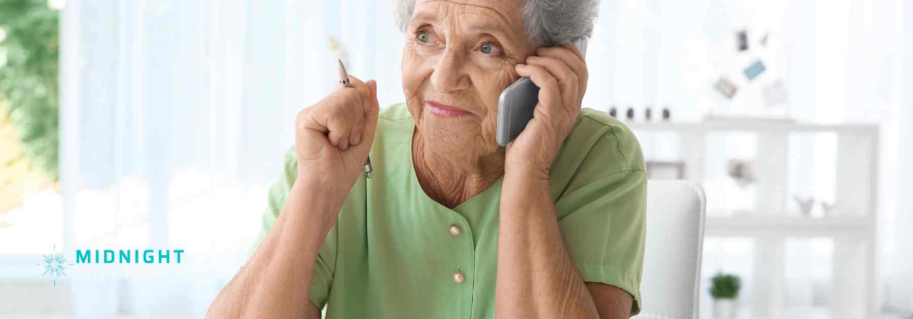 Happy elderly person with good hearing on the phone