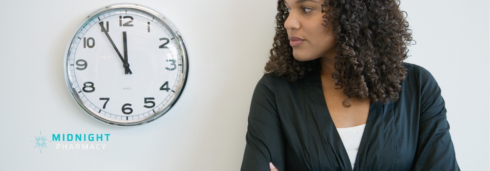 Woman waiting for travel vaccines next to a clock to represent time constraints
